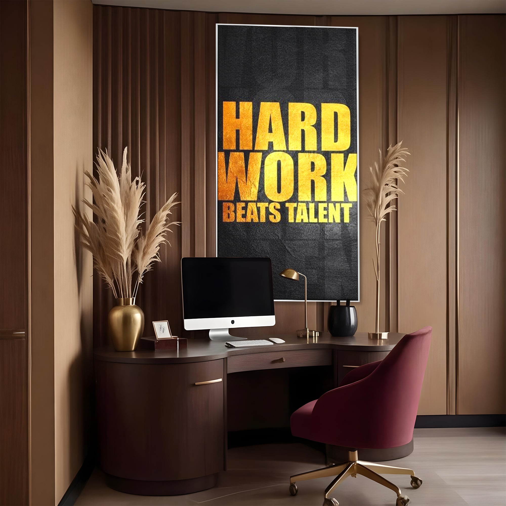 Tablou canvas cu tablou motivational cu mesaj aurit, in rama de aluminiu argintiu, pe perete intr-un birou